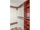 Well-organized walk-in closet with custom shelving and hanging rods at 1280 W Peachtree Nw St # 3709, Atlanta, GA 30309