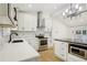 Modern kitchen featuring white cabinets, black countertops, stainless steel appliances and decorative backsplash at 3469 Sexton Woods Dr, Atlanta, GA 30341