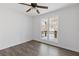 Simple bedroom with hardwood floors and a double window at 4596 Stewart Reilly Nw Dr, Acworth, GA 30101