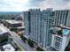 Stunning aerial view of the high rise building with modern architecture, pool, and lush surrounding landscape at 250 Pharr Ne Rd # 1618, Atlanta, GA 30305