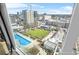 Stunning aerial view from the residence showcasing the pool, green space, and city skyline at 250 Pharr Ne Rd # 1618, Atlanta, GA 30305