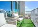Balcony with artificial turf, seating, and open city views, offering an inviting outdoor space at 250 Pharr Ne Rd # 1618, Atlanta, GA 30305