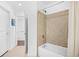 Hall bathroom featuring a tiled shower-tub combo and white fixtures, providing a clean and functional space at 250 Pharr Ne Rd # 1618, Atlanta, GA 30305