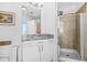 Bathroom showcasing granite counters, a shower with glass door, and modern fixtures at 250 Pharr Ne Rd # 1618, Atlanta, GA 30305