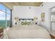 Bright bedroom with a king bed, large windows offering beautiful views, and access to an ensuite bathroom at 250 Pharr Ne Rd # 1618, Atlanta, GA 30305