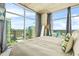 Relaxing bedroom boasts floor-to-ceiling windows with stunning city views, creating a serene atmosphere at 250 Pharr Ne Rd # 1618, Atlanta, GA 30305