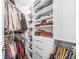 Well-organized walk-in closet with ample shelving and hanging space for efficient storage at 250 Pharr Ne Rd # 1618, Atlanta, GA 30305
