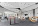 Spacious community room with modern decor, dining area, and lounge seating at 250 Pharr Ne Rd # 1618, Atlanta, GA 30305