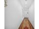 Hallway features dark wood floors and a colorful patterned rug, illuminated by recessed lighting at 250 Pharr Ne Rd # 1618, Atlanta, GA 30305