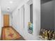 Hallway features dark wood floors, a patterned rug, and built-in shelving displaying beverages at 250 Pharr Ne Rd # 1618, Atlanta, GA 30305