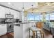 Open kitchen and living area with granite countertops, stainless steel appliances, and city views at 250 Pharr Ne Rd # 1618, Atlanta, GA 30305