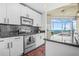 Modern eat-in kitchen featuring stainless steel appliances and a sleek black backsplash at 250 Pharr Ne Rd # 1618, Atlanta, GA 30305