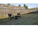 Spacious backyard with a well-maintained lawn, a fire pit and outdoor seating at 3117 Haynes Park Dr, Lithonia, GA 30038