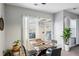 Bright dining area with modern light fixture and large windows at 3117 Haynes Park Dr, Lithonia, GA 30038