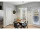 Modern dining area featuring a glass table, contemporary lighting, and stylish decor at 3117 Haynes Park Dr, Lithonia, GA 30038