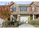 Charming townhome with brick facade, shuttered windows, covered entry, and attached one car garage at 3117 Haynes Park Dr, Lithonia, GA 30038
