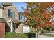 Beautiful brick townhome featuring a covered entryway, one-car garage, and attractive landscaping at 3117 Haynes Park Dr, Lithonia, GA 30038