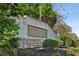 A stone and brick sign reads Haynes Park and is surrounded by trees and bushes at 3117 Haynes Park Dr, Lithonia, GA 30038