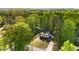 Aerial view of property, surrounded by lush trees and professionally maintained landscape at 4201 Brookview Se Dr, Atlanta, GA 30339