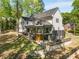 Rear exterior showcasing outdoor living space with a porch and a well-maintained landscaped yard at 4201 Brookview Se Dr, Atlanta, GA 30339