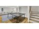 Spacious basement with a ping pong table and comfortable seating at 4201 Brookview Se Dr, Atlanta, GA 30339