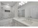 Elegant bathroom featuring double sinks, marble accents, and a shower-tub combo at 4201 Brookview Se Dr, Atlanta, GA 30339