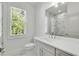 Bathroom featuring sink with marble shower and window at 4201 Brookview Se Dr, Atlanta, GA 30339