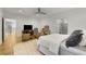 Bright bedroom featuring an ensuite bathroom, hardwood floors, and modern lighting at 4201 Brookview Se Dr, Atlanta, GA 30339