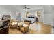 Bright bedroom features hardwood floors, two armchairs, and two windows at 4201 Brookview Se Dr, Atlanta, GA 30339
