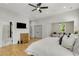 Bright bedroom with hardwood floors, a walk-in closet, and an ensuite bathroom at 4201 Brookview Se Dr, Atlanta, GA 30339