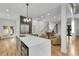 Open-concept kitchen with island seating, stainless steel appliances, and access to outdoor patio at 4201 Brookview Se Dr, Atlanta, GA 30339