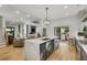 Spacious kitchen with an island, modern lighting, stainless appliances, and an open floor plan at 4201 Brookview Se Dr, Atlanta, GA 30339