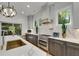 Modern kitchen with stainless steel appliances, light countertops, dark cabinets, and a view of the outdoor patio at 4201 Brookview Se Dr, Atlanta, GA 30339
