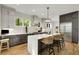 Bright kitchen with stainless appliances, gray cabinets, an island with seating, and hardwood floors at 4201 Brookview Se Dr, Atlanta, GA 30339