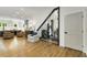 Bright, open living area with hardwood floors, modern staircase, and comfortable seating at 4201 Brookview Se Dr, Atlanta, GA 30339