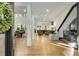 Open-concept living space with hardwood floors, high ceilings, and an inviting view of the kitchen and dining area at 4201 Brookview Se Dr, Atlanta, GA 30339
