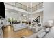 Bright living room with hardwood floors, an open staircase, soaring ceilings, and plenty of natural light at 4201 Brookview Se Dr, Atlanta, GA 30339