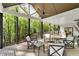Spacious covered porch with seating overlooking a wooded backyard at 4201 Brookview Se Dr, Atlanta, GA 30339