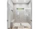 Sleek walk-in shower features modern fixtures, mosaic tile flooring, and a built-in bench at 4201 Brookview Se Dr, Atlanta, GA 30339