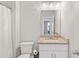 Well-lit bathroom featuring a granite countertop vanity, modern fixtures, and a neutral color palette at 8050 Tristan Way, Whitesburg, GA 30185