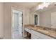 Elegant bathroom featuring granite countertops, a large mirror, and ample cabinet space at 8050 Tristan Way, Whitesburg, GA 30185