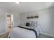 Cozy bedroom with a queen bed, decorative pillows, and an ensuite bathroom at 8050 Tristan Way, Whitesburg, GA 30185