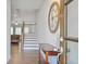 Inviting foyer with hardwood floors, a decorative clock, and a staircase leading to the upper level at 8050 Tristan Way, Whitesburg, GA 30185