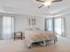 Large main bedroom boasting tray ceilings, neutral carpet, and bright natural light at 8050 Tristan Way, Whitesburg, GA 30185