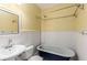 Bathroom featuring a clawfoot tub, classic fixtures, and beadboard walls at 1007 Blue Ridge Ne Ave, Atlanta, GA 30306