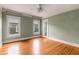 Spacious bedroom with hardwood floors, light green walls, and natural light at 1007 Blue Ridge Ne Ave, Atlanta, GA 30306