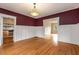 Dining room featuring wainscoting and hardwood floors leading to kitchen at 1007 Blue Ridge Ne Ave, Atlanta, GA 30306