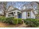 Attractive home featuring a prominent front porch, a blue entry door, and a well-kept garden at 1007 Blue Ridge Ne Ave, Atlanta, GA 30306