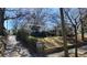 Quaint home nestled among trees with a stone pathway and attractive landscaping offering a serene setting at 1007 Blue Ridge Ne Ave, Atlanta, GA 30306