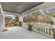 Expansive front porch with ample space, stone pillars, and decorative white railings, perfect for relaxing at 1007 Blue Ridge Ne Ave, Atlanta, GA 30306